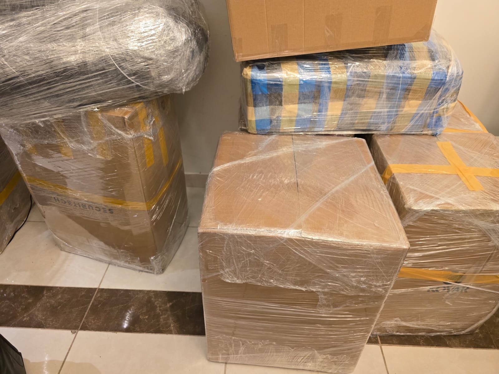 PackPoint Movers moving team handling furniture in Dubai