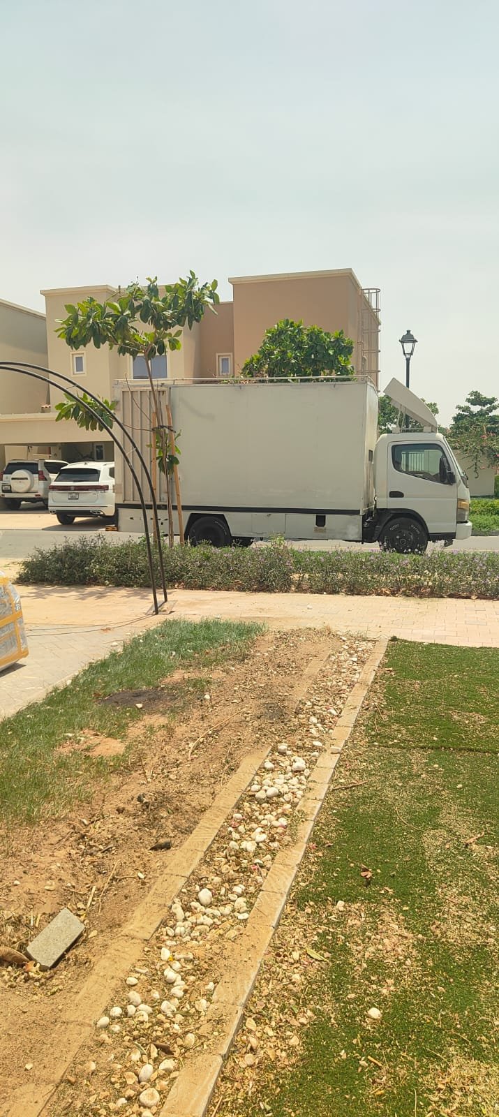 PackPoint Movers office relocation team moving workstations in Dubai